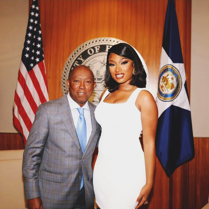 Megan Thee Stallion posing with Houston Mayor Sylvester after receiving the key to the city